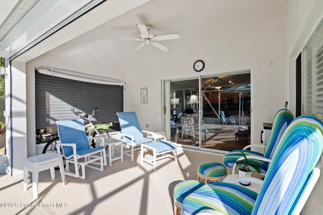 a work room with furniture and a large window