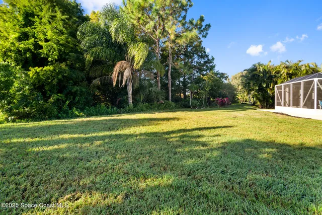a view of a swimming pool with an outdoor space and seating area