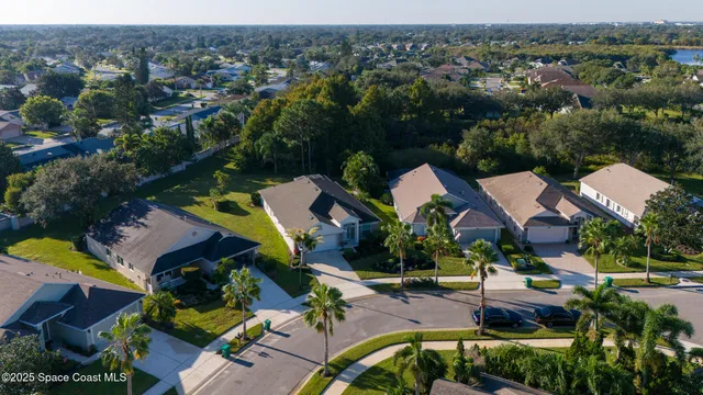 an aerial view of residential house with outdoor space and river