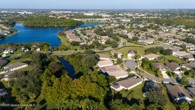 an aerial view of a house with outdoor space