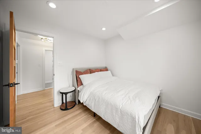 a bedroom with a bed and a mirror