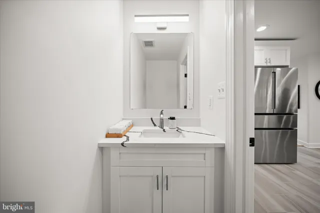a bathroom with a sink and a mirror