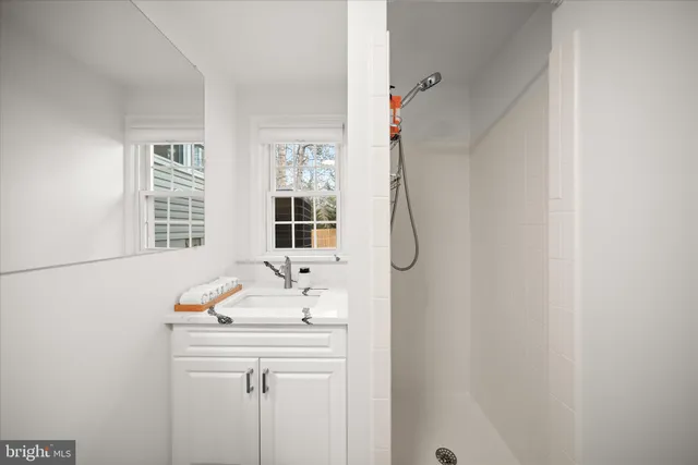 a bathroom with a sink and a window