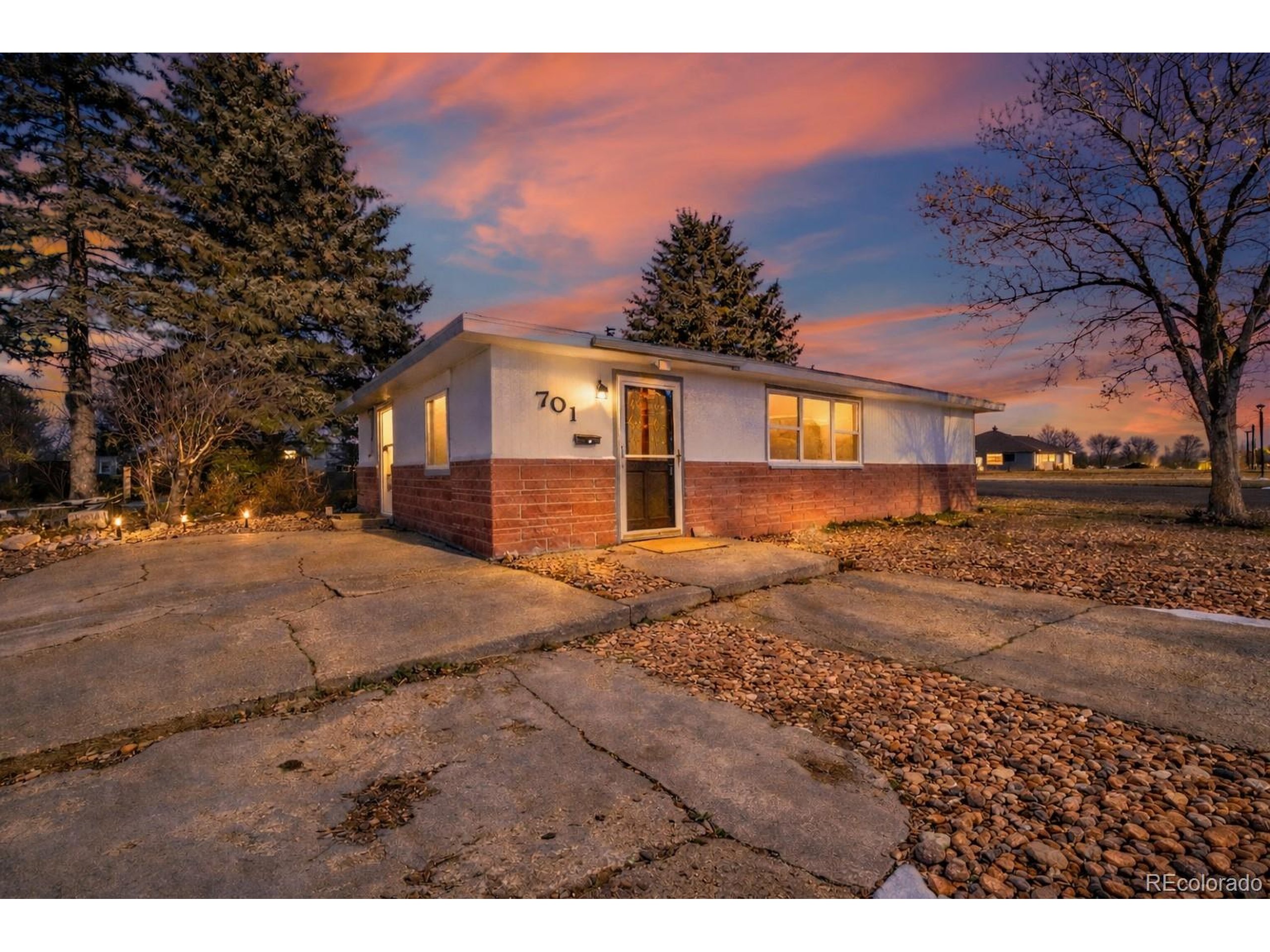 701 4th Street Akron, CO 80720 - Photo 2 of 26 a front view of a house with a yard and mountain view