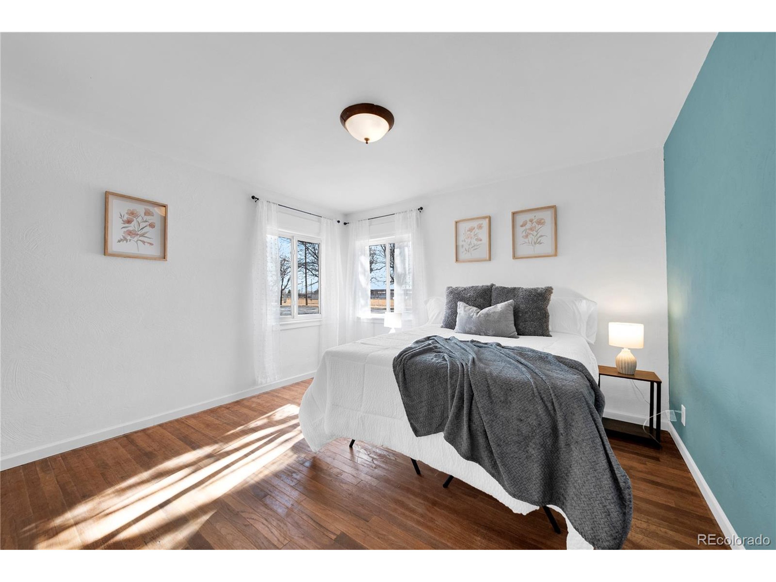 701 4th Street Akron, CO 80720 - Photo 21 of 26 a bedroom with a bed and a desk