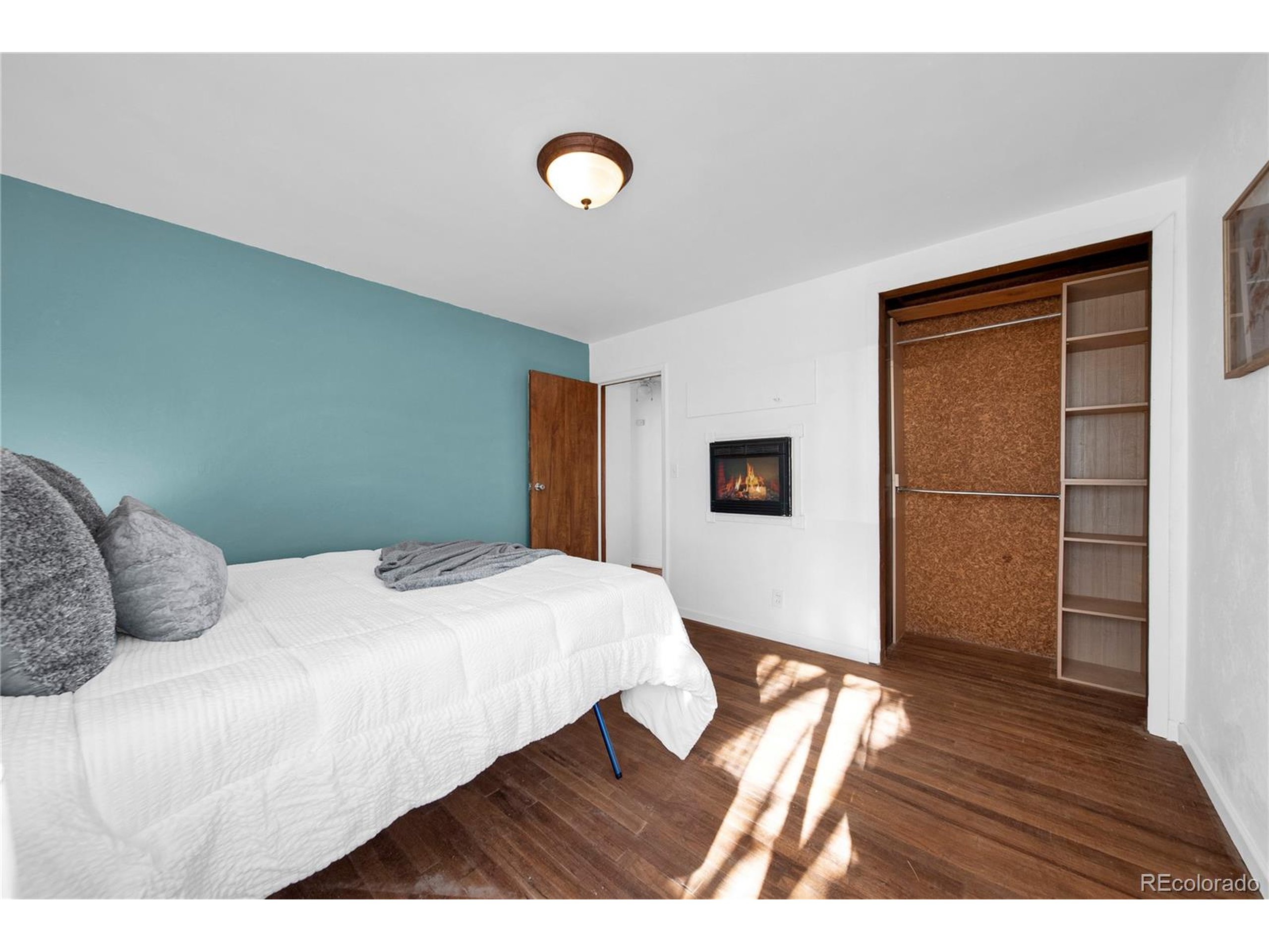 701 4th Street Akron, CO 80720 - Photo 22 of 26 a bedroom with a bed and a dresser