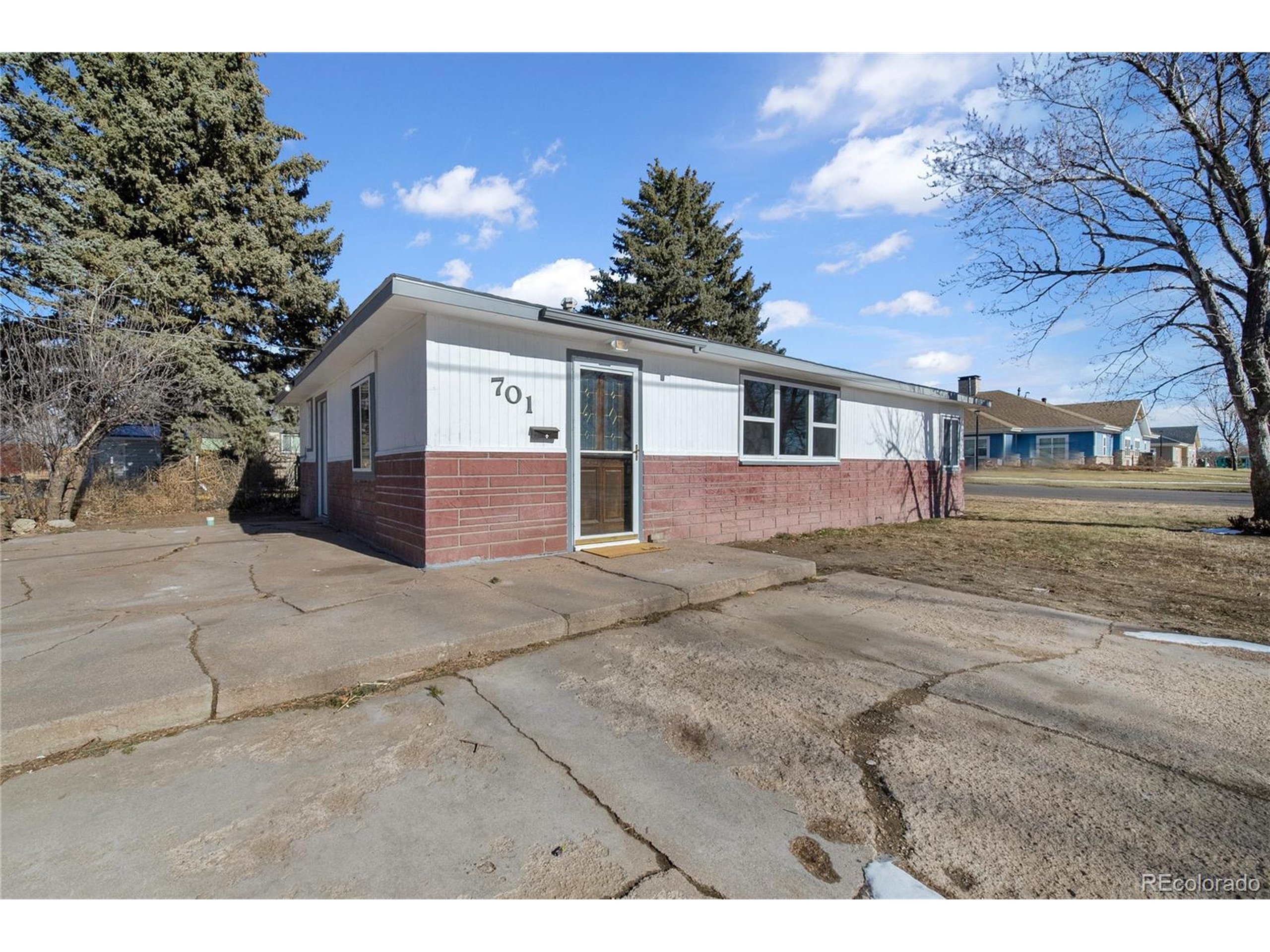 701 4th Street Akron, CO 80720 - Photo 3 of 26 a view of a house with a yard