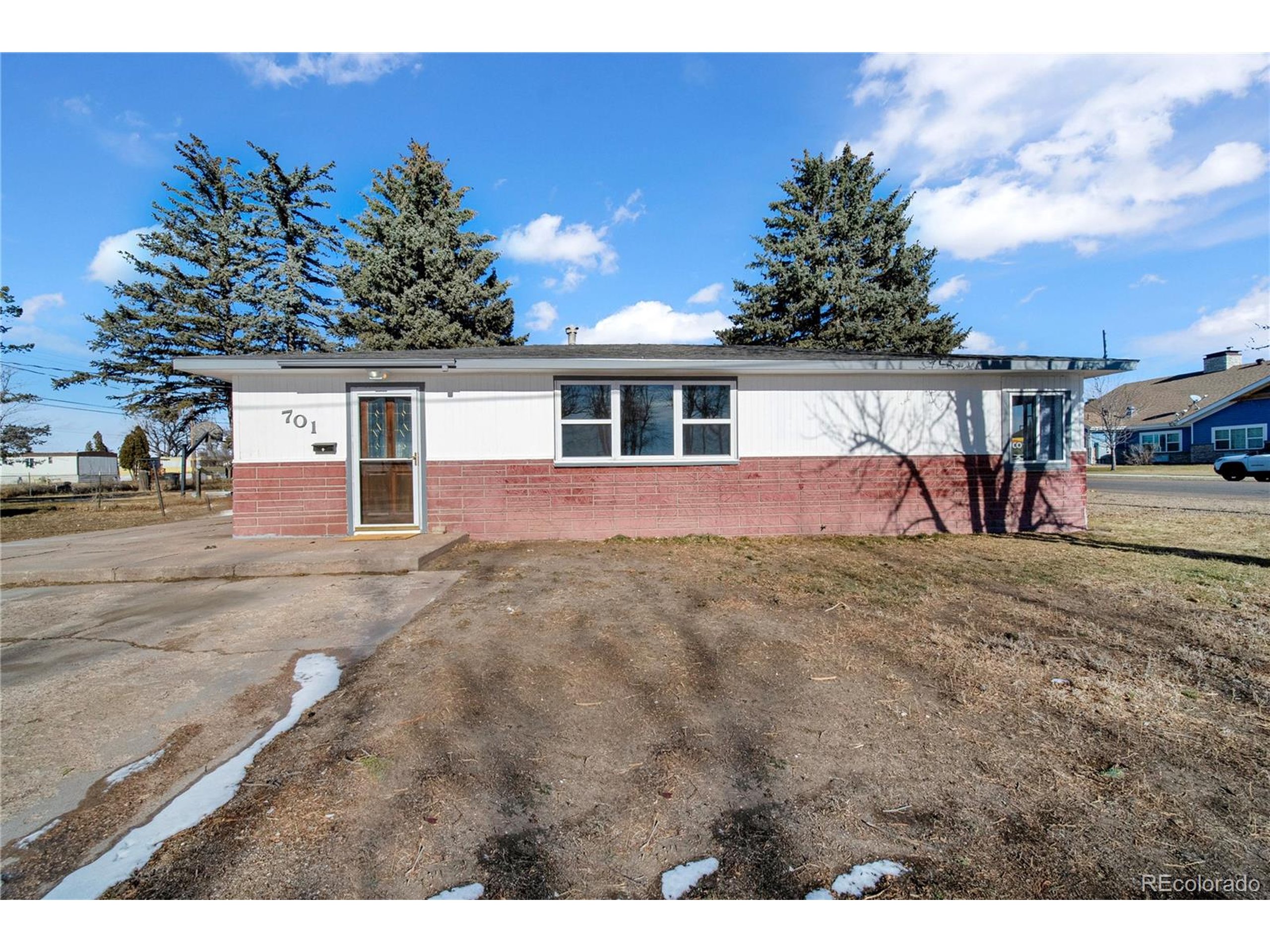701 4th Street Akron, CO 80720 - Photo 4 of 26 a view of a house with backyard and trees