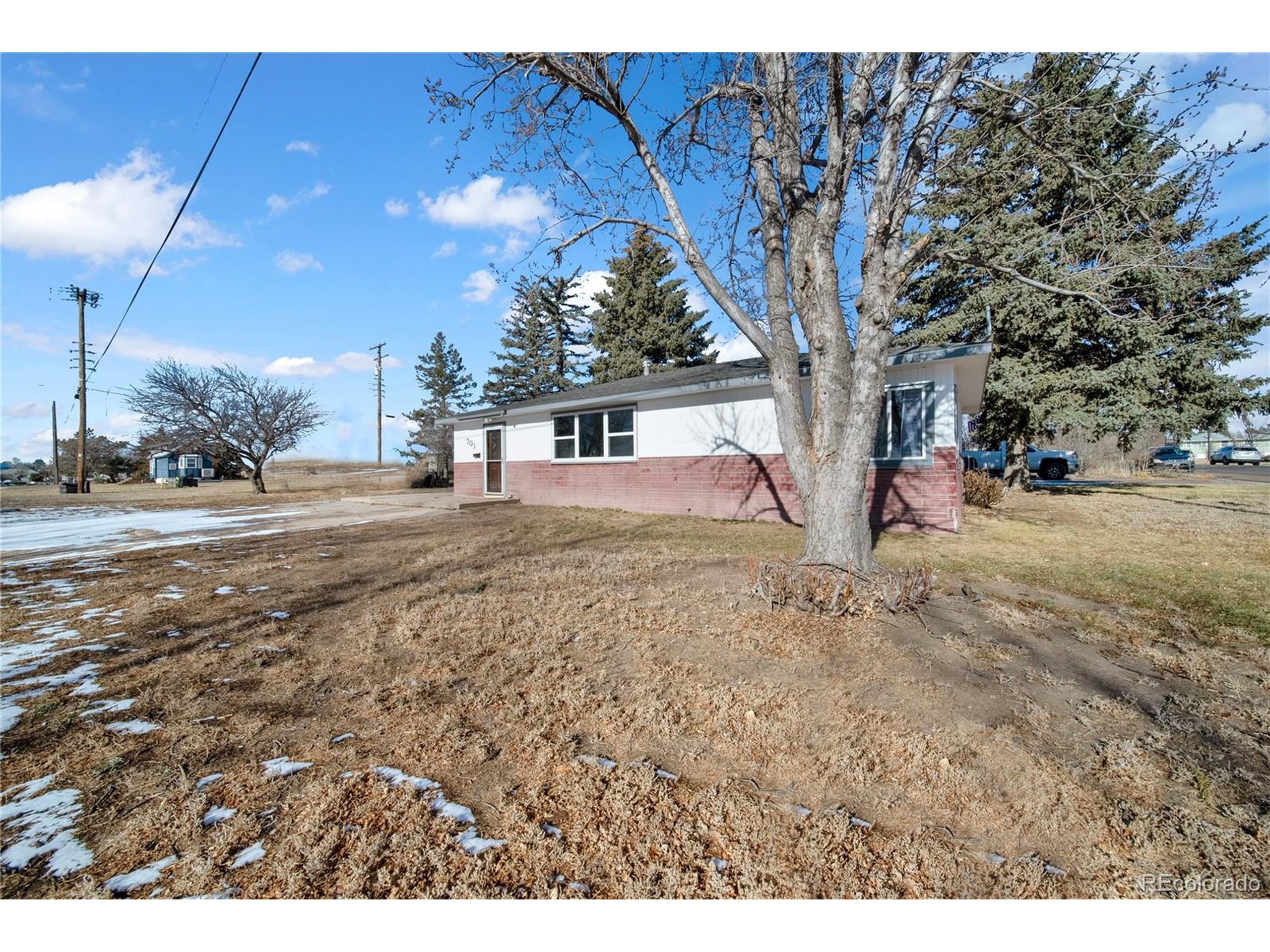 701 4th Street Akron, CO 80720 - Photo 5 of 26 a view of outdoor space with deck and backyard