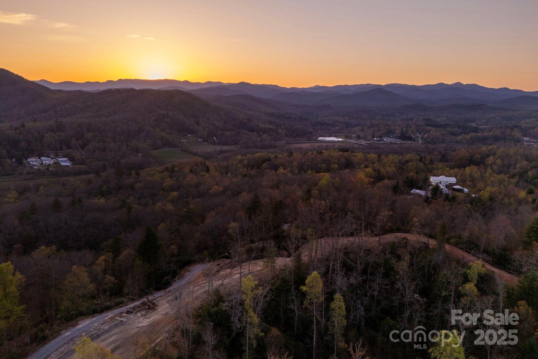 Lot # Masterpiece View Drive, Unit 5 Hendersonville, NC 28739 - Photo 17 of 30 a view of a house with a field