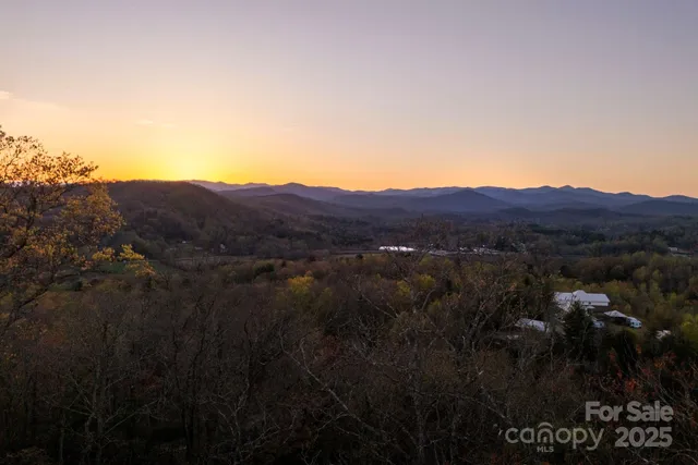a view of a house with a mountain