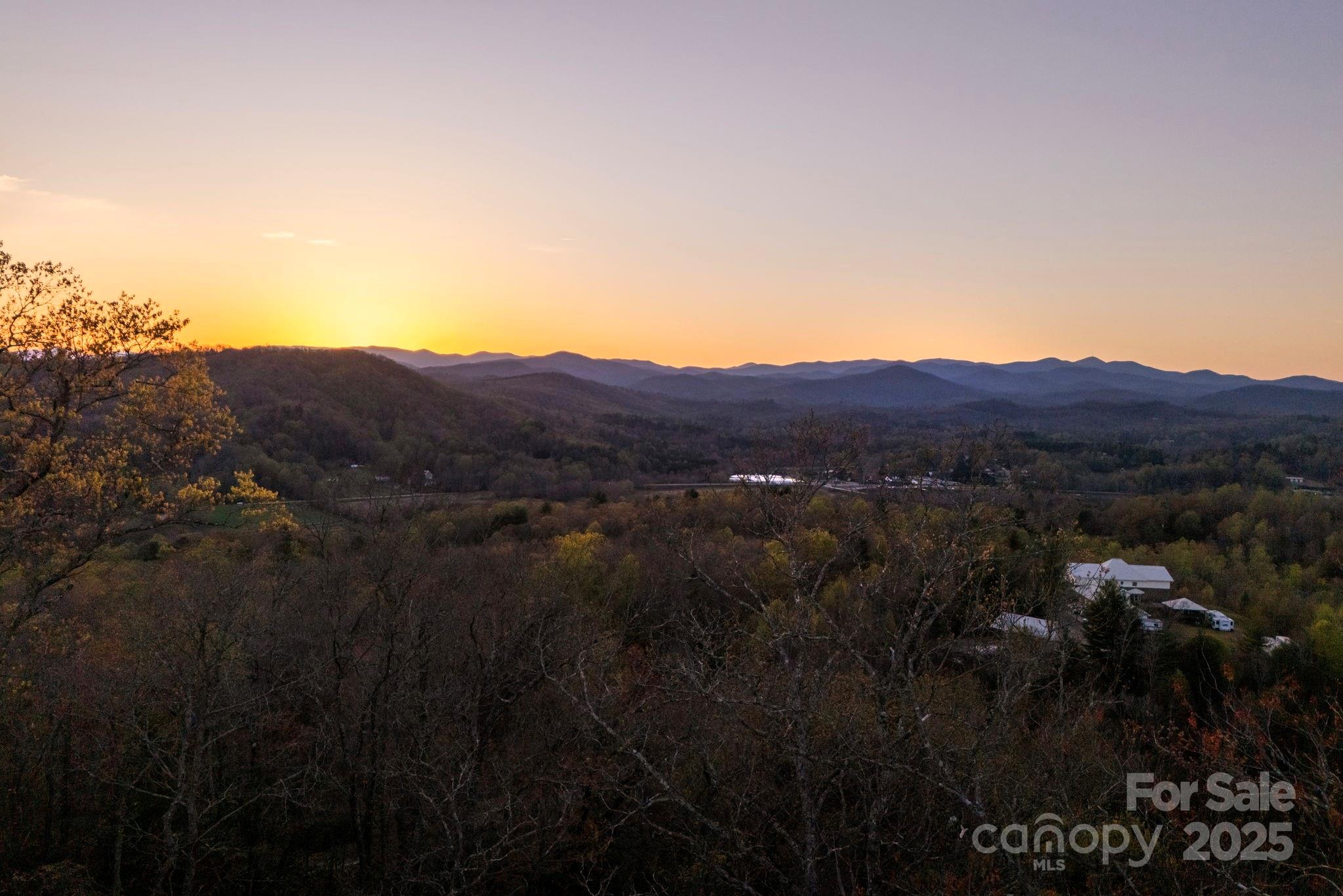 Lot # Masterpiece View Drive, Unit 5 Hendersonville, NC 28739 - Photo 21 of 30 a view of a large mountain with a mountain in the background