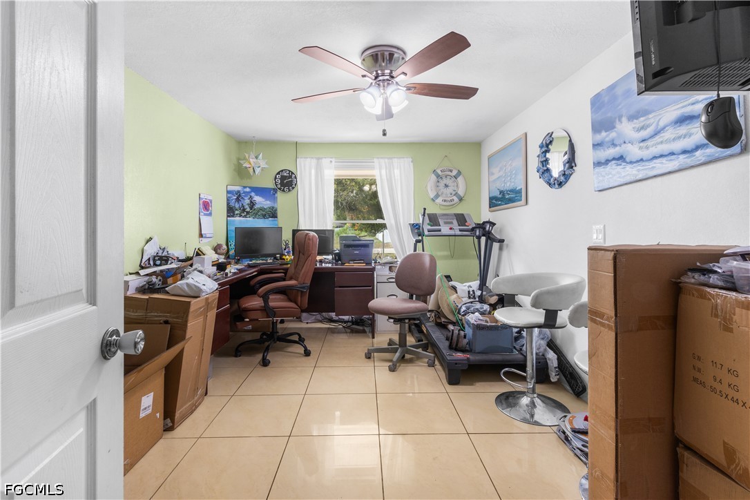 18 Illinois Road Lehigh Acres, FL 33936 - Photo 27 of 45 a living room with furniture and a large window