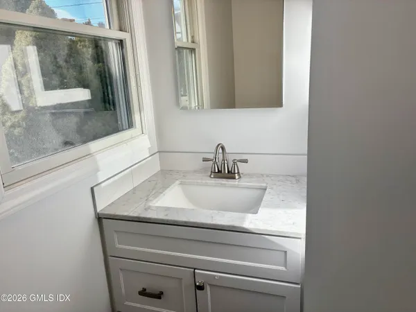 a close view of a sink and a mirror
