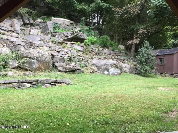a backyard of a house with lots of green space