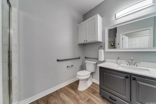 a bathroom with a sink toilet and vanity