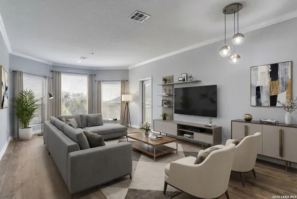 a living room with furniture and a flat screen tv