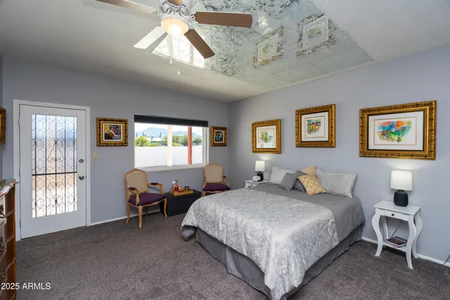 a bathroom with double vanity and a mirror