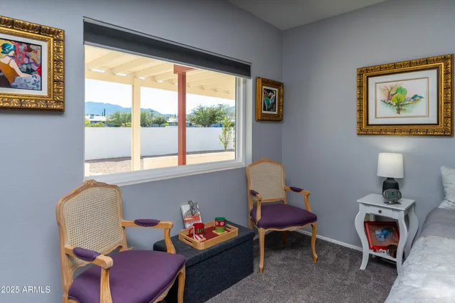 a view of a house with porch and a floor to ceiling window