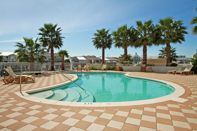 211 Durango Road, Unit 715 Destin, FL 32541 - Photo 4 of 11 a view of a swimming pool with a lounge chair