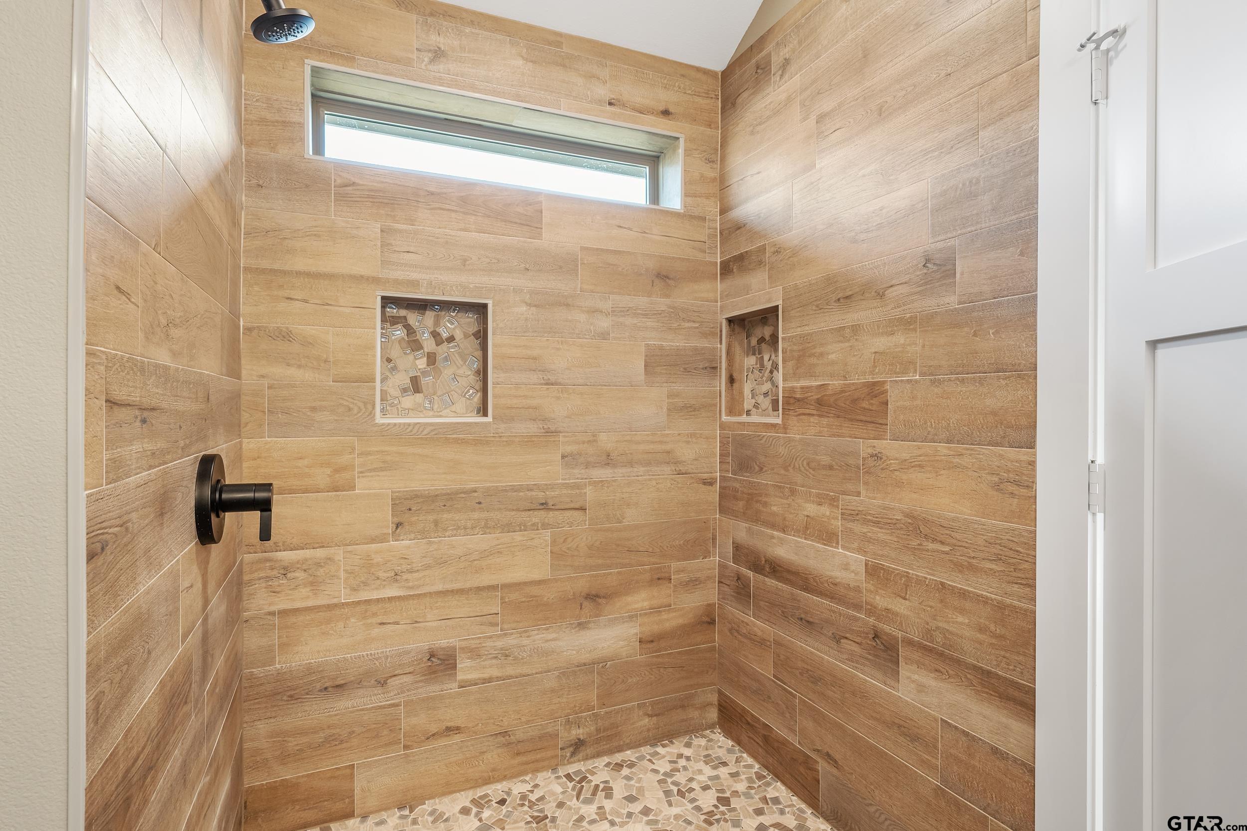 16418 Crossing Circle Lindale, TX 75771 - Photo 13 of 31 a bathroom with a shower