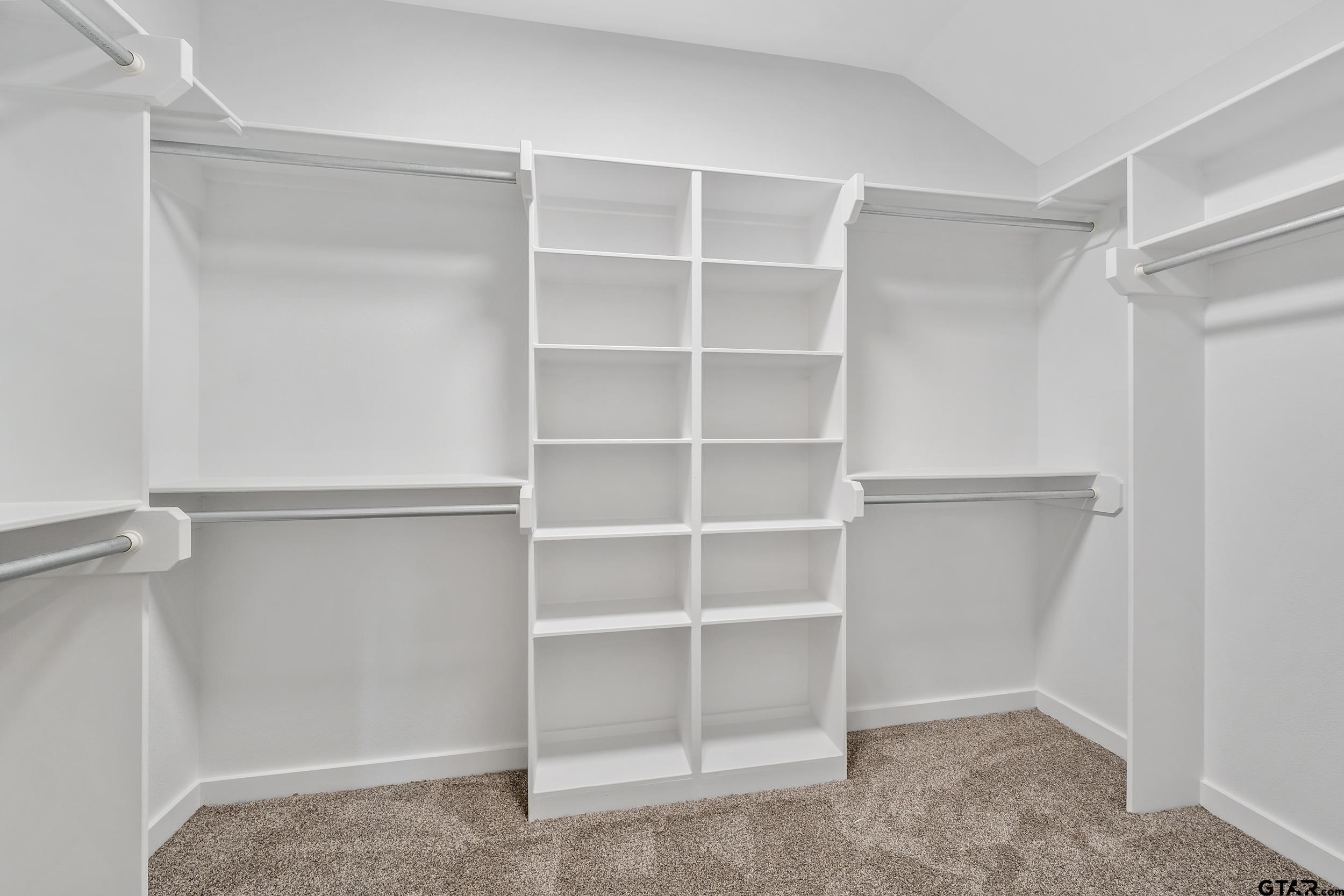 16418 Crossing Circle Lindale, TX 75771 - Photo 14 of 31 a view of an empty walk in closet