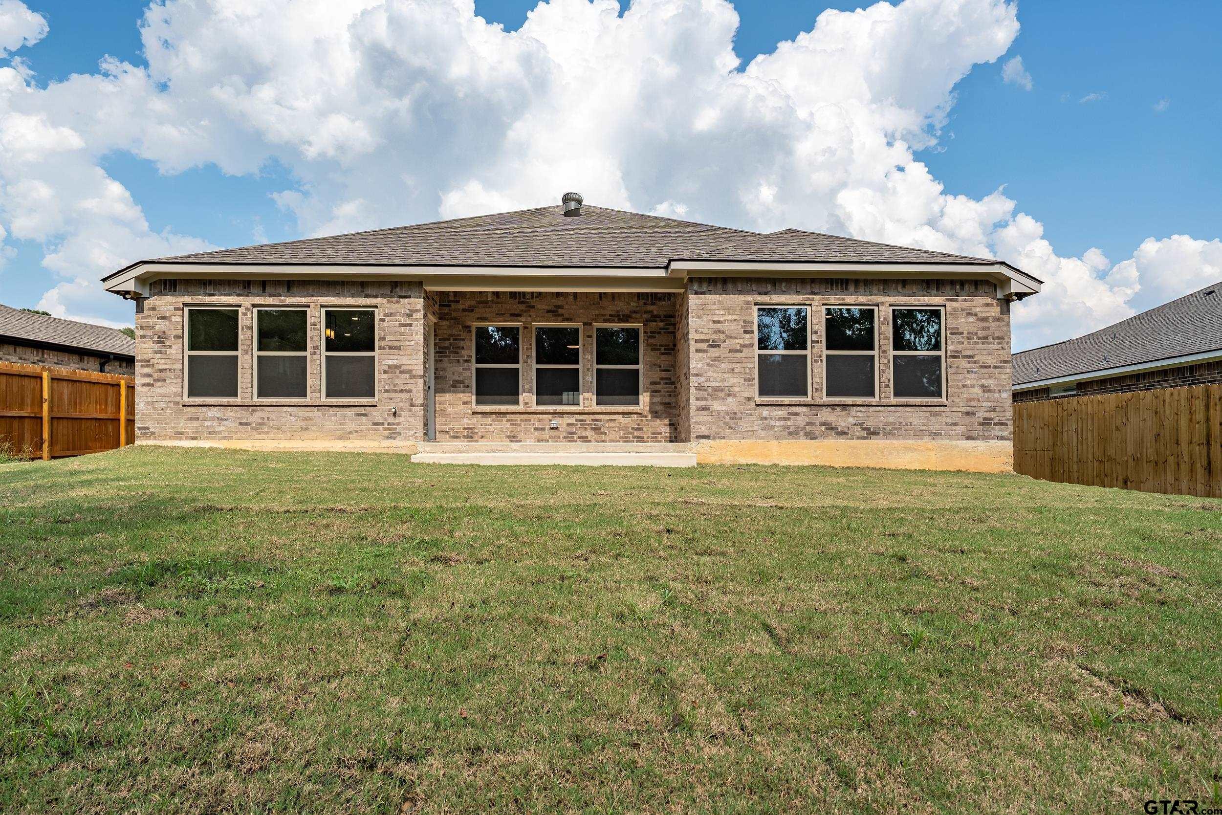 16418 Crossing Circle Lindale, TX 75771 - Photo 24 of 31 a front view of a house with a garden