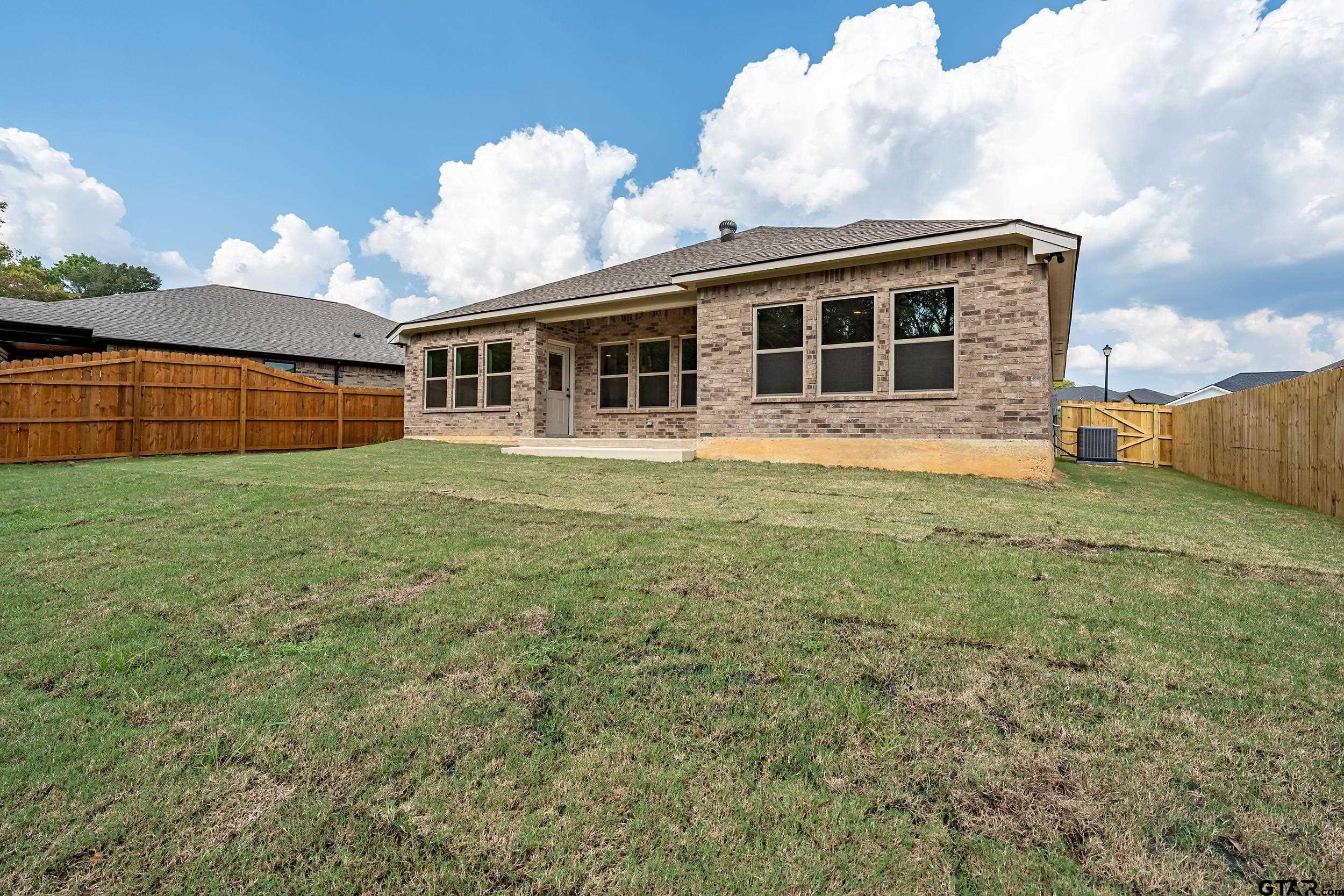 16418 Crossing Circle Lindale, TX 75771 - Photo 25 of 31 a view of house with yard and sitting area