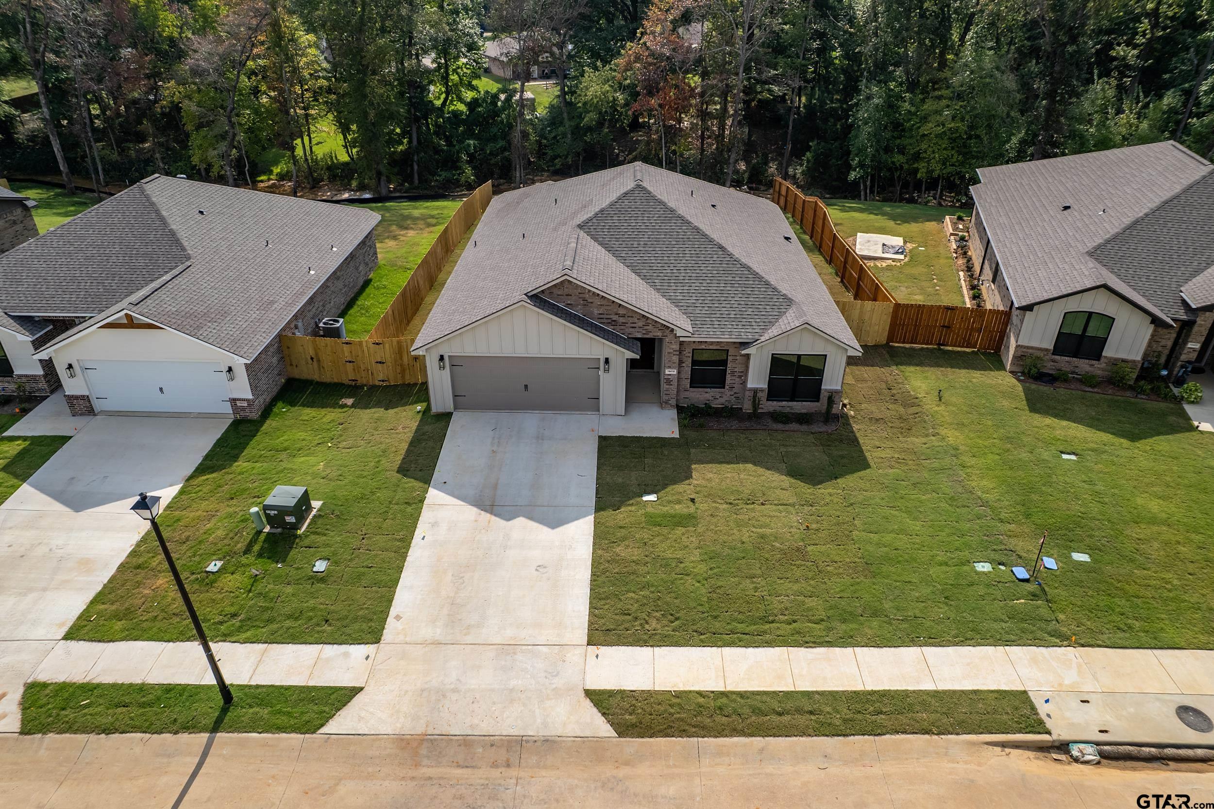 16418 Crossing Circle Lindale, TX 75771 - Photo 26 of 31 an aerial view of a house