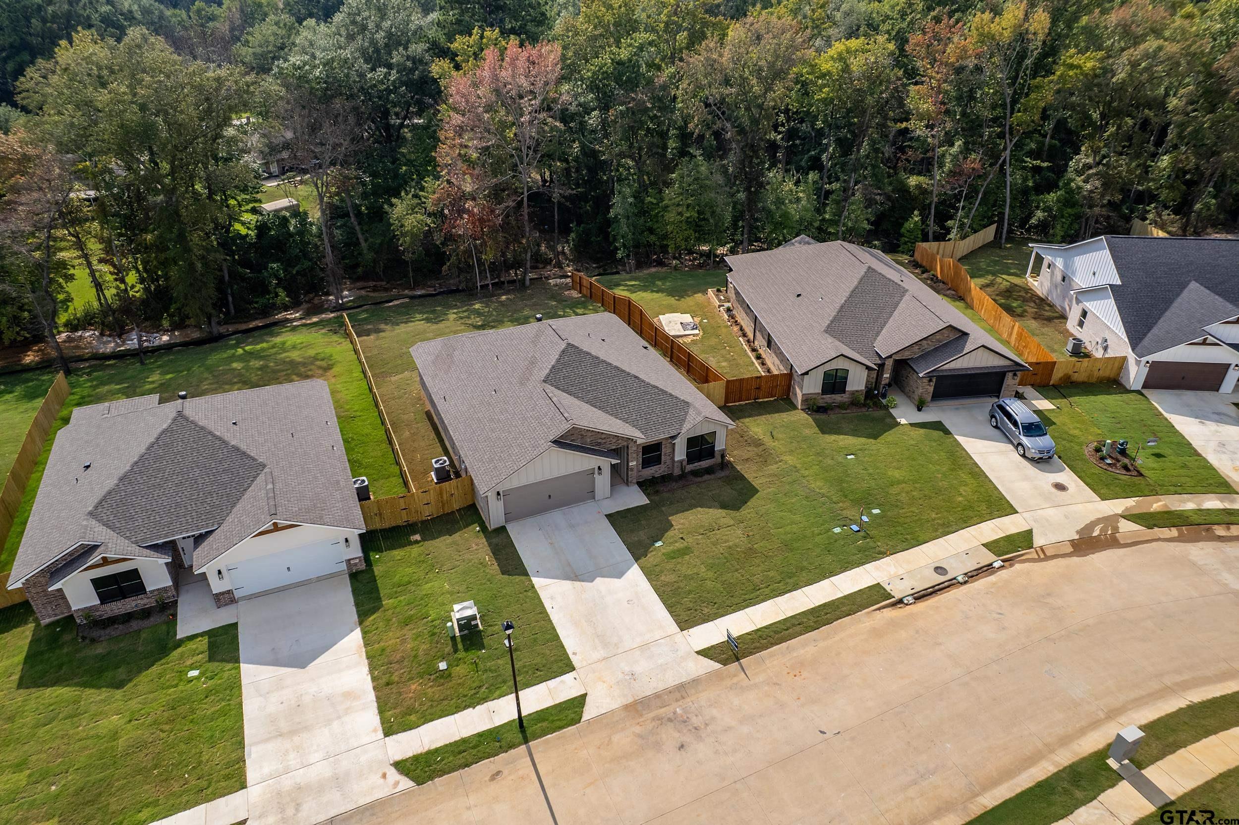 16418 Crossing Circle Lindale, TX 75771 - Photo 27 of 31 an aerial view of a house with swimming pool and patio