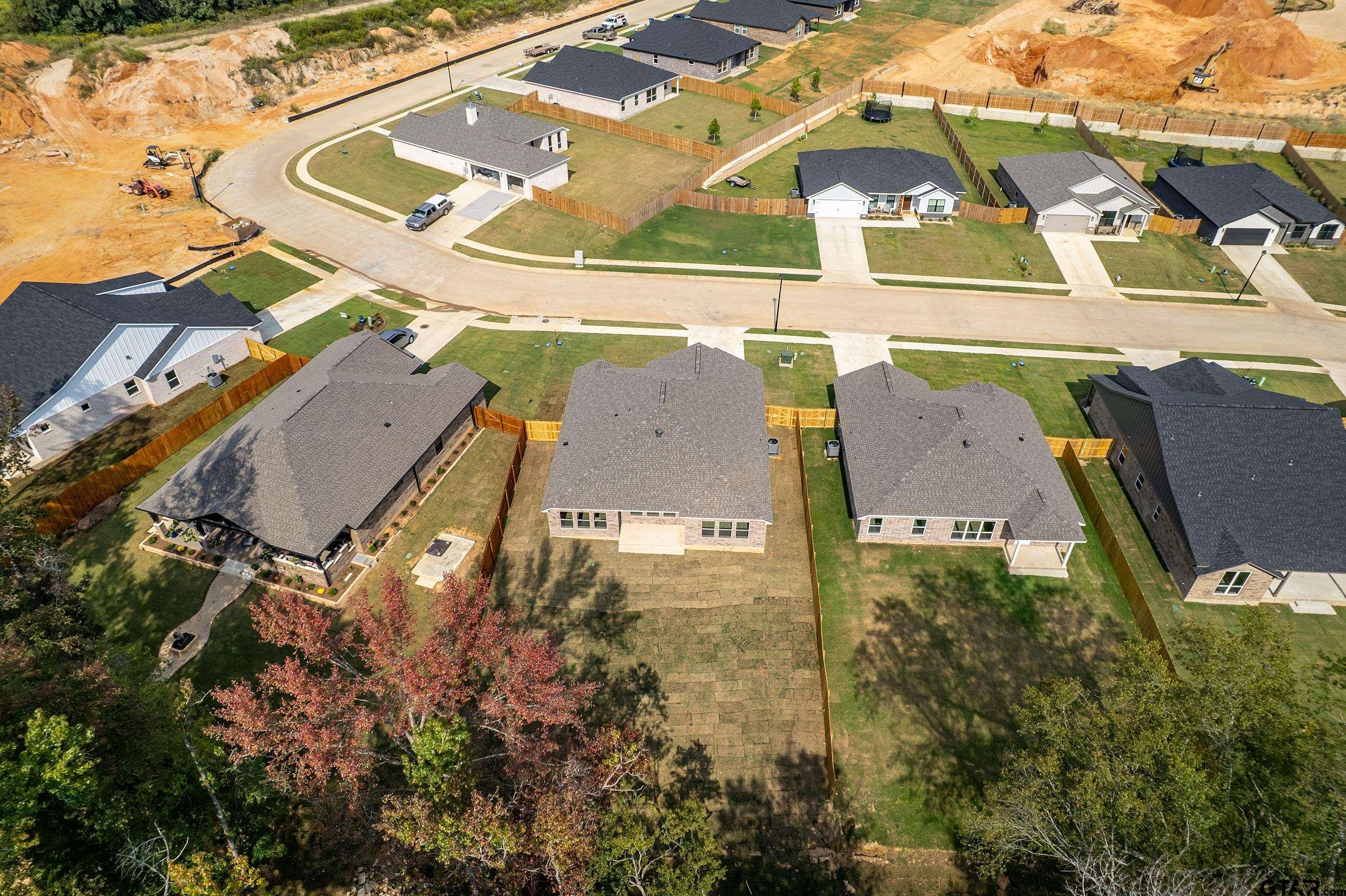 16418 Crossing Circle Lindale, TX 75771 - Photo 29 of 31 an aerial view of residential houses with outdoor space