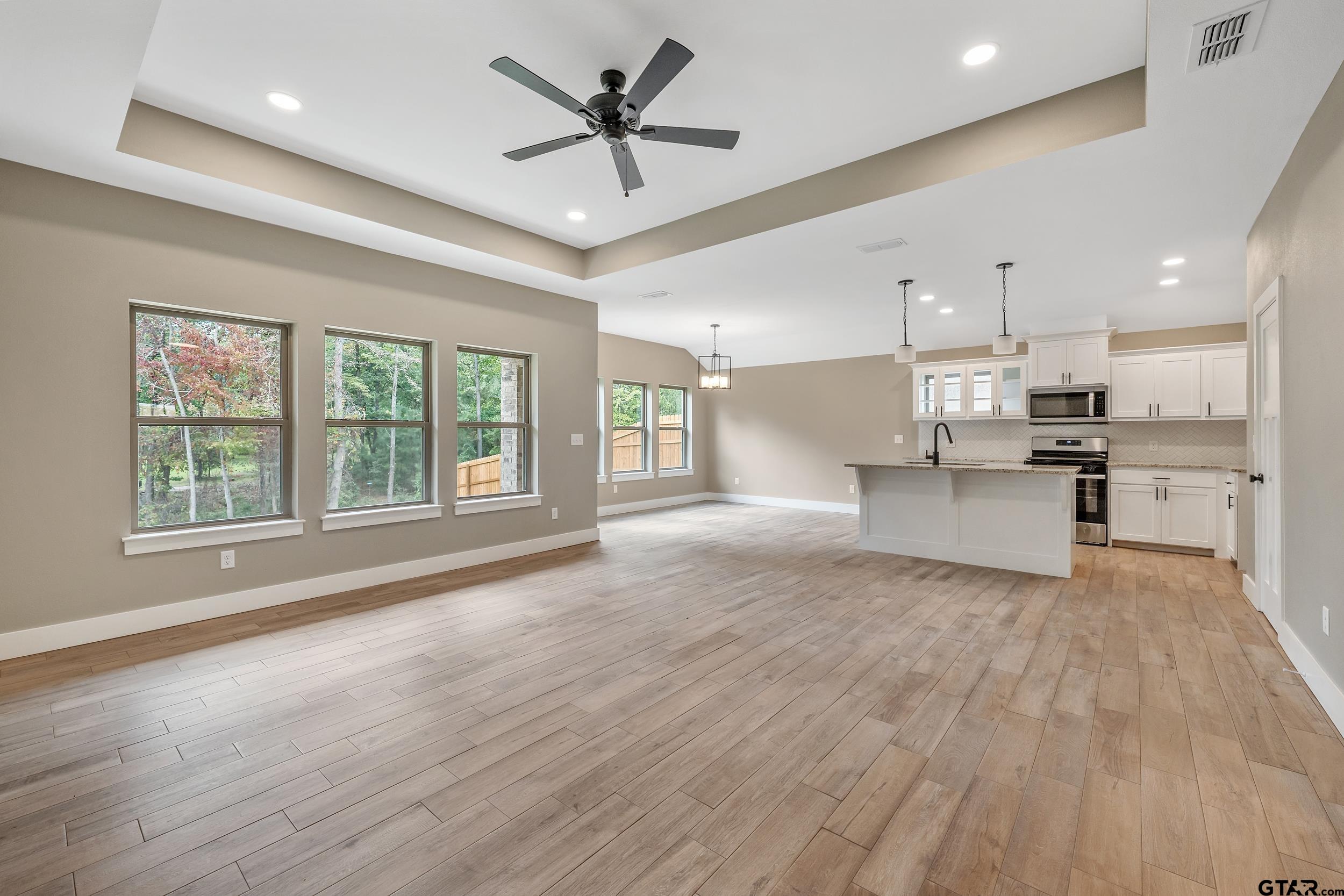 16418 Crossing Circle Lindale, TX 75771 - Photo 3 of 31 a view of an empty room with kitchen appliances and a window