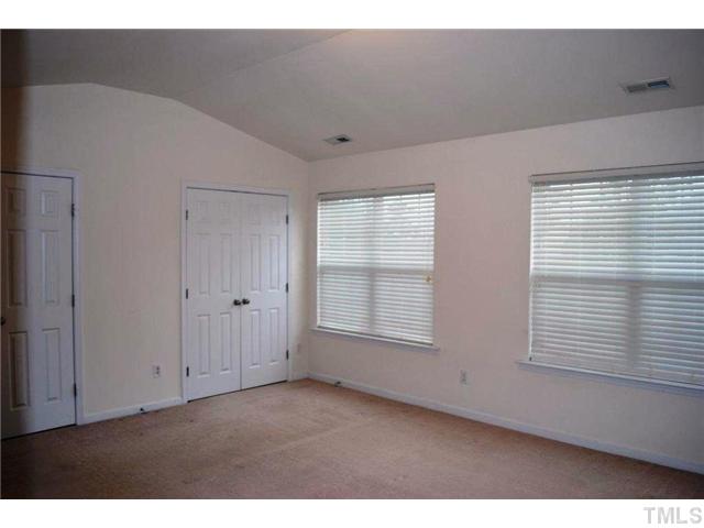 8214 Belneath Court Raleigh, NC 27613 - Photo 9 of 17 a view of an empty room with a window