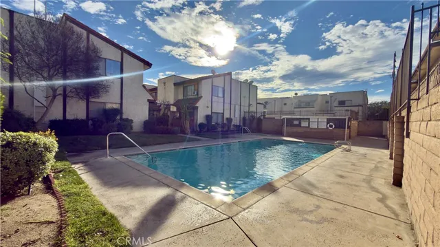 a view of a backyard with sitting area