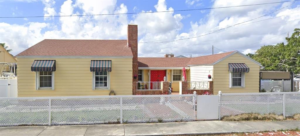1906 Southwest 17th Court Miami, FL 33145 - Photo 1 of 33 a front view of a house with garden