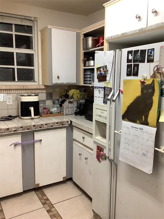 1906 Southwest 17th Court Miami, FL 33145 - Photo 15 of 33 a kitchen with stainless steel appliances granite countertop a stove and a sink