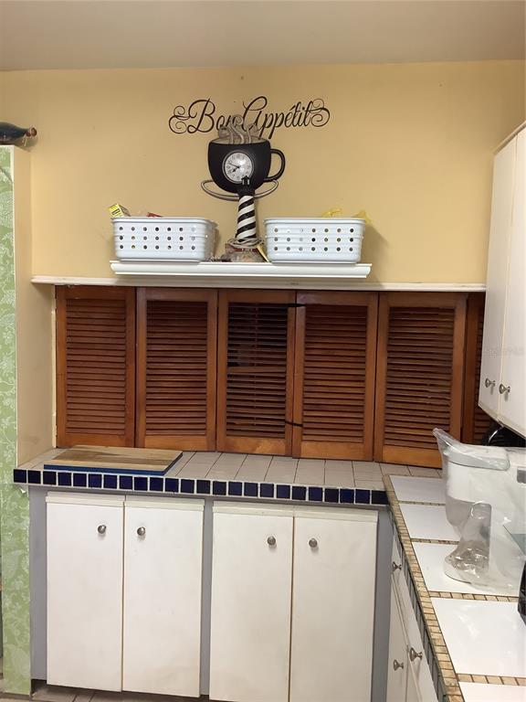 1906 Southwest 17th Court Miami, FL 33145 - Photo 16 of 33 a view of a kitchen with a sink and a stove