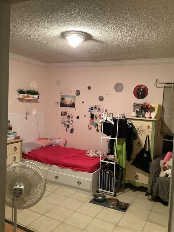 1906 Southwest 17th Court Miami, FL 33145 - Photo 17 of 33 a bedroom with a bed and cabinets