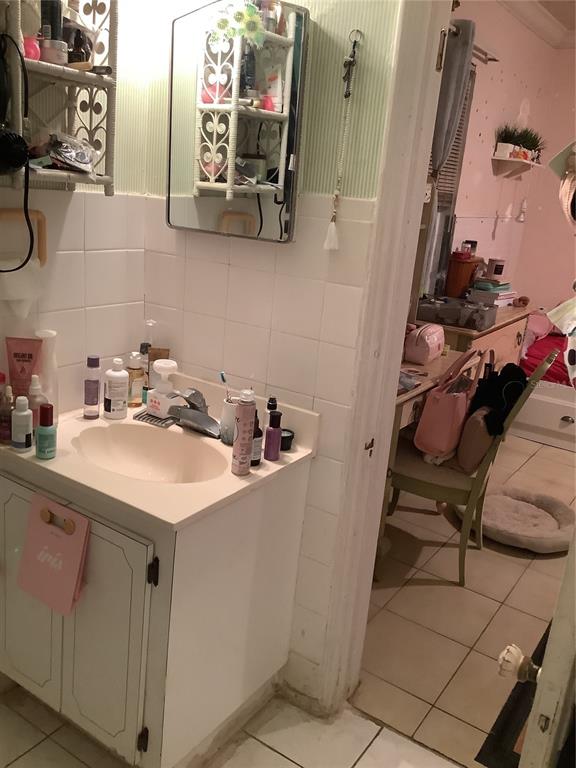 1906 Southwest 17th Court Miami, FL 33145 - Photo 20 of 33 a bathroom with a sink and mirror