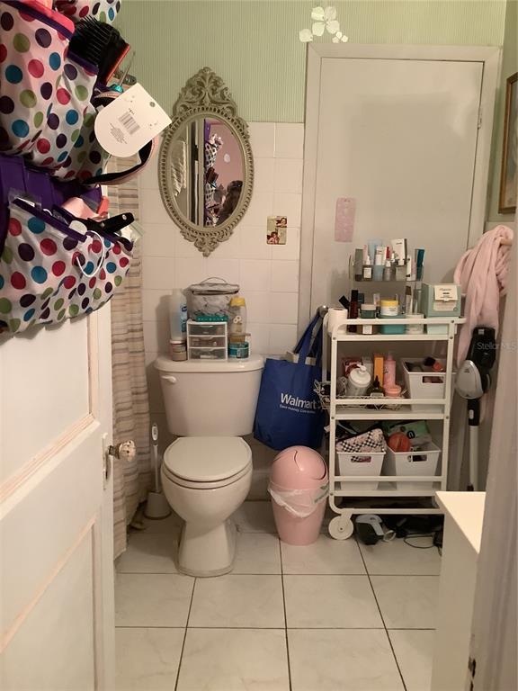 1906 Southwest 17th Court Miami, FL 33145 - Photo 21 of 33 a bathroom with a toilet a sink and a mirror