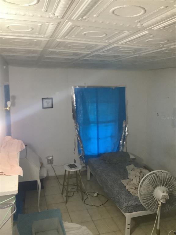 1906 Southwest 17th Court Miami, FL 33145 - Photo 22 of 33 a view of a room with table chairs and windows