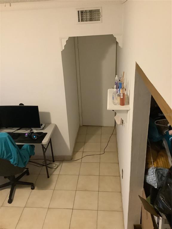 1906 Southwest 17th Court Miami, FL 33145 - Photo 25 of 33 a workspace with furniture and a gate