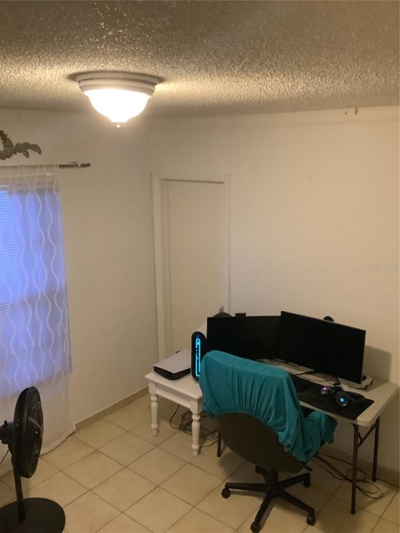1906 Southwest 17th Court Miami, FL 33145 - Photo 26 of 33 a living room with furniture and a lamp