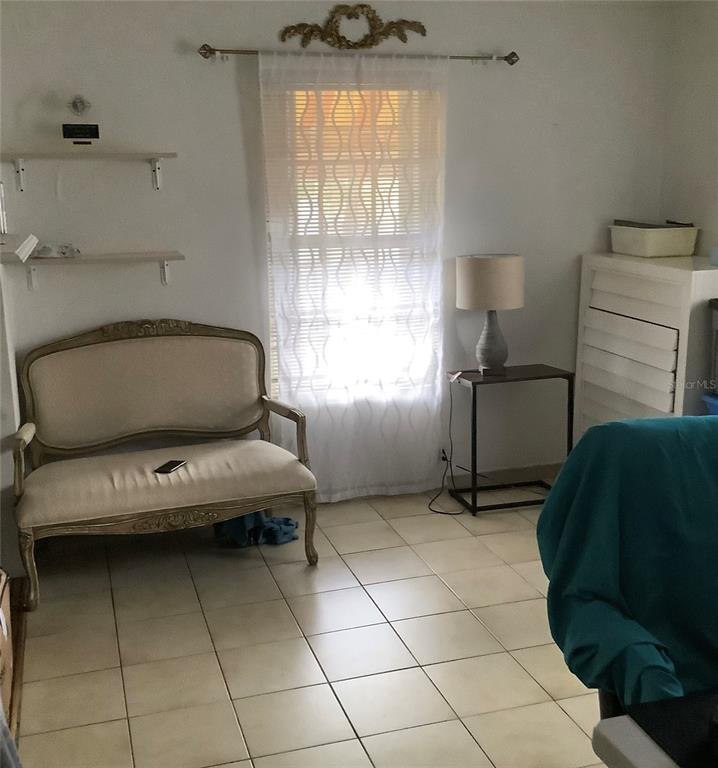 1906 Southwest 17th Court Miami, FL 33145 - Photo 27 of 33 a living room with a couch and a window