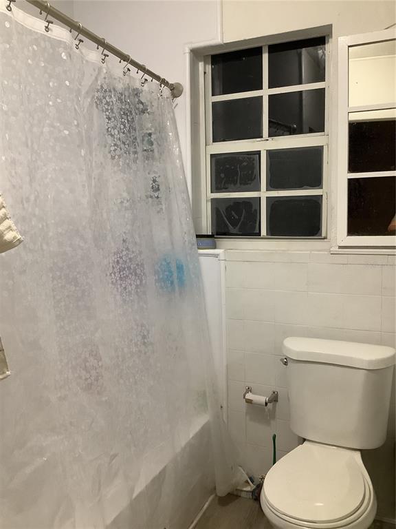 1906 Southwest 17th Court Miami, FL 33145 - Photo 29 of 33 a white toilet sitting next to a shower