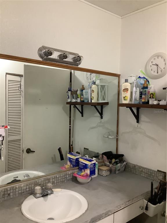 1906 Southwest 17th Court Miami, FL 33145 - Photo 30 of 33 a bathroom with a sink and a mirror