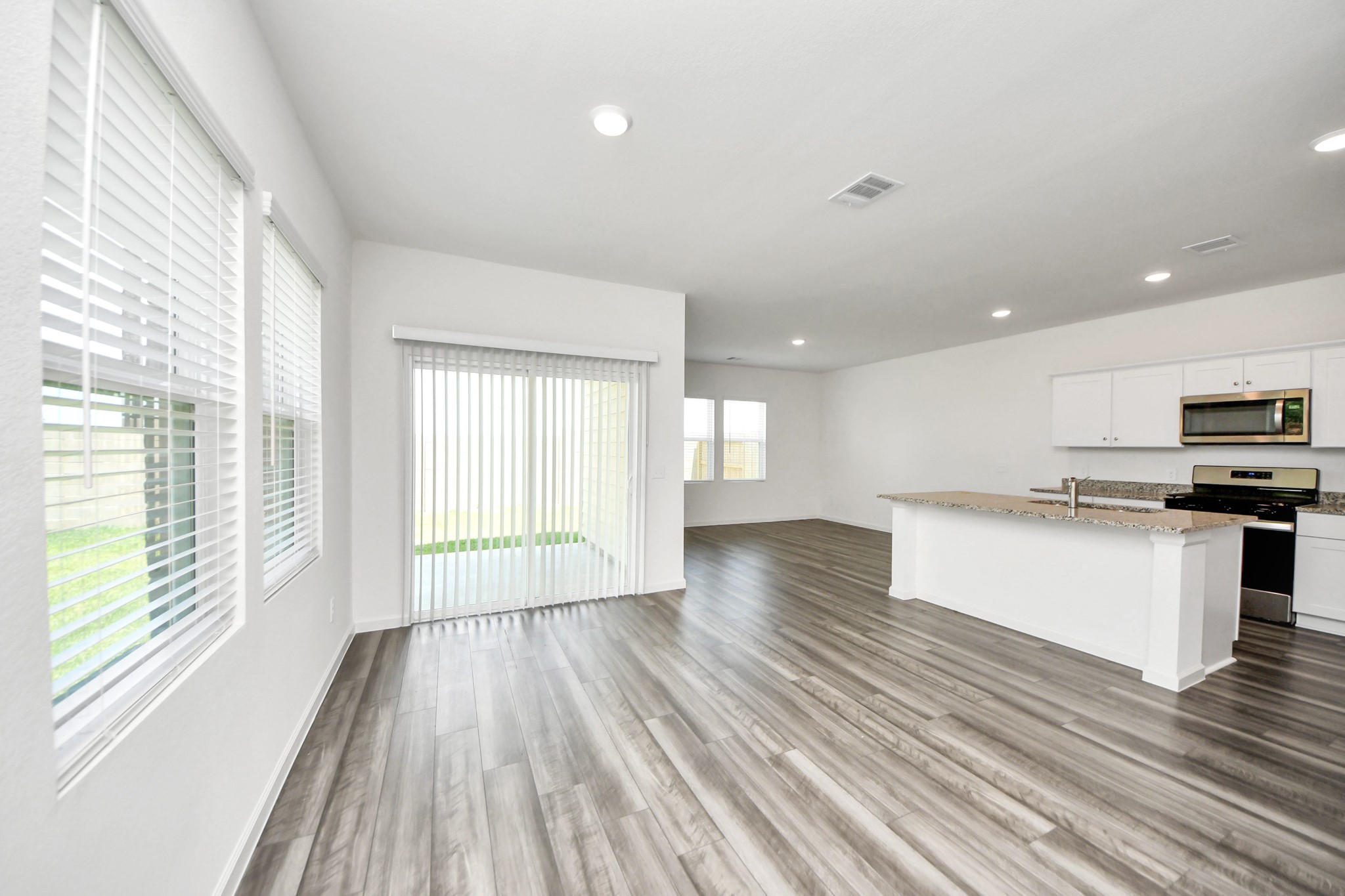 10303 Rose Mar Drive, Unit B Rosharon, TX 77583 - Photo 7 of 49 a view of kitchen with wooden floor and electronic appliances