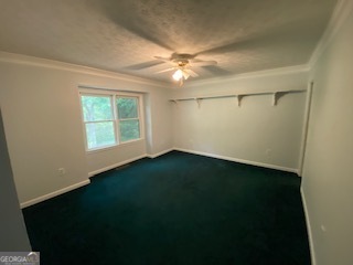 1117 Boss Hardy Road Auburn, GA 30011 - Photo 17 of 19 an empty room with a fan & a window