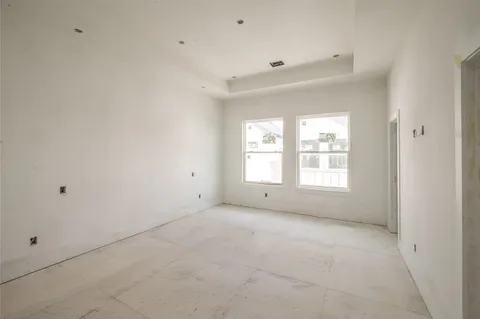 an empty room with a empty space and a window