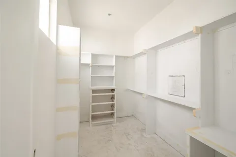 a bathroom with a tub and a window